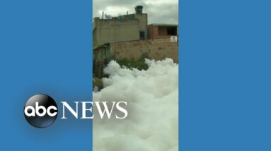 Clouds of toxic foam seen floating on Colombian river