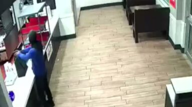 Surveillance camera catches man holding gun up to employees at Maryland KFC